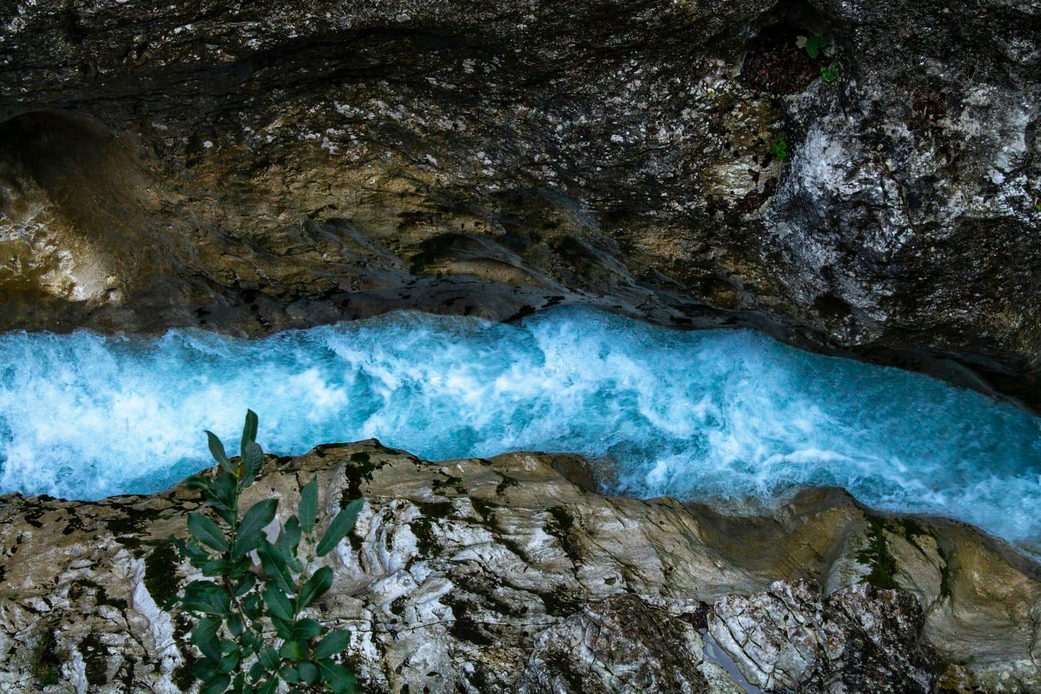 Clear water flowing gently over rocks